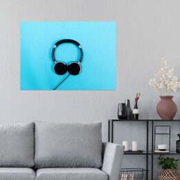 Plakat Czarne słuchawki na błękitnym tle