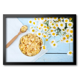 Obraz w ramie Płatki kukurydziane na błękitnym drewnianym stole