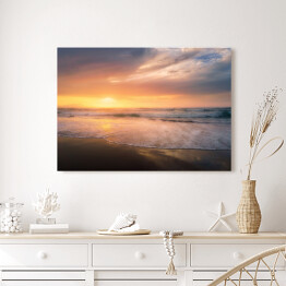 Obraz na płótnie Brzeg plaży o zachodzie słońca