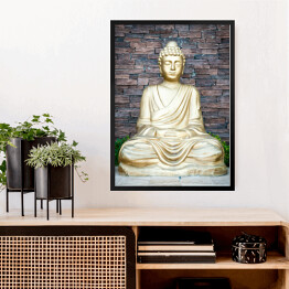 Obraz w ramie Złoty Budda na tle ściany z cegieł