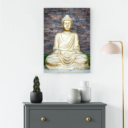 Obraz na płótnie Złoty Budda na tle ściany z cegieł