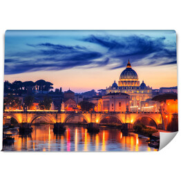 Most i Watykan oświetlony złotymi światłami podczas zmierzchu