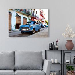 Obraz na płótnie Niebieski klasyczny samochód na ulicach Hawany, Kuba