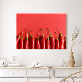 Obraz na płótnie Czerwona papryka chili na czerwonym tle