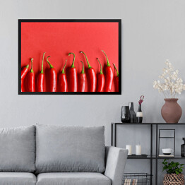 Obraz w ramie Czerwona papryka chili na czerwonym tle