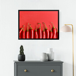 Obraz w ramie Czerwona papryka chili na czerwonym tle