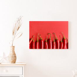 Obraz na płótnie Czerwona papryka chili na czerwonym tle