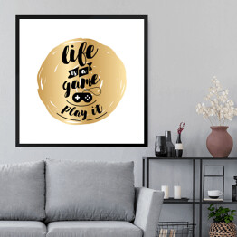 Obraz w ramie "Życie to gra, zagraj w nią" - czarny tekst na złotym tle