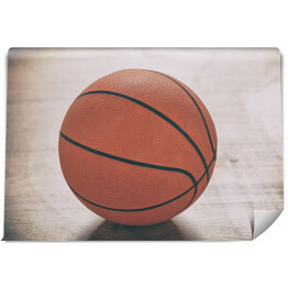 Fototapeta Piłka do gry w koszykówkę na drewnianej podłodze