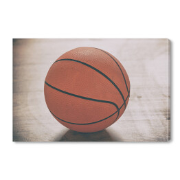 Obraz na płótnie Piłka do gry w koszykówkę na drewnianej podłodze