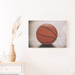 Obraz na płótnie Piłka do gry w koszykówkę na drewnianej podłodze