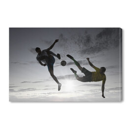 Obraz na płótnie Sylwetki dwóch piłkarzy na szarym niebie