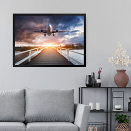 Obraz w ramie Samolot i drewniany most o zachodzie słońca