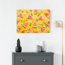 Obraz na płótnie Cytryny i limonki z arbuzem na żółtym tle