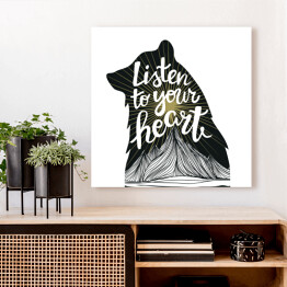 Obraz na płótnie Ilustracja z czarnym niedźwiedziem, słońcem i górami oraz podpisem "posłuchaj swojego serca"