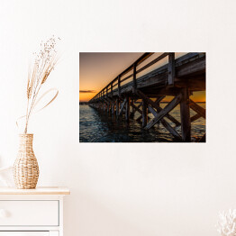 Plakat samoprzylepny Widok budowy mostu na tle zachodzącego słońca