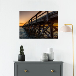 Plakat samoprzylepny Widok budowy mostu na tle zachodzącego słońca
