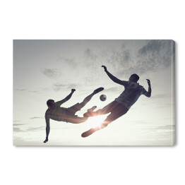 Obraz na płótnie Sylwetki dwóch piłkarzy na tle jasnego słońca
