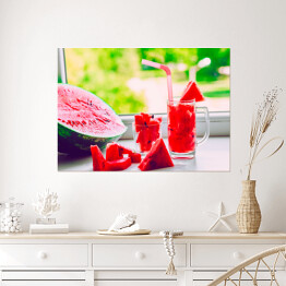 Plakat Szklanka ze słomkami i sokiem z arbuza na parapecie