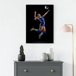 Obraz na płótnie Kobieta grająca w siatkówkę na czarnym tle