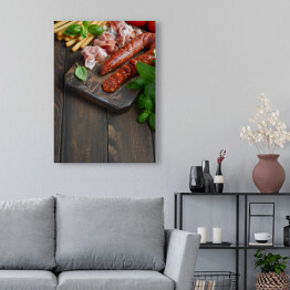 Obraz na płótnie Hiszpańska tradycyjna kiełbasa chorizo z świeżymi ziołami i pomidorami