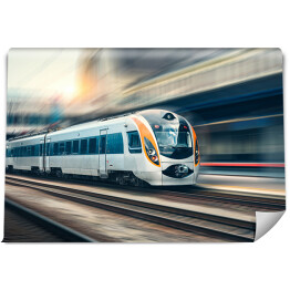 Fototapeta Szybki pociąg w ruchu na stacji kolejowej