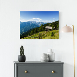 Obraz na płótnie Drewniana chata na alpejskim wzgórzu