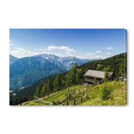 Obraz na płótnie Drewniana chata na alpejskim wzgórzu