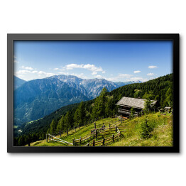 Obraz w ramie Drewniana chata na alpejskim wzgórzu