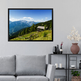 Obraz w ramie Drewniana chata na alpejskim wzgórzu