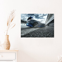 Plakat samoprzylepny Czarno niebieski sportowy samochód na torze wyścigowym
