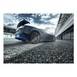 Plakat samoprzylepny Czarno niebieski sportowy samochód na torze wyścigowym
