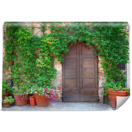 Fototapeta Piękne stare drewniane drzwi dekorowane kwiatami, Włochy