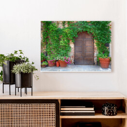 Obraz na płótnie Piękne stare drewniane drzwi dekorowane kwiatami, Włochy