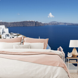 Fototapeta Widok na białe domy i niebieskie dachy na Santorini
