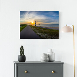 Obraz na płótnie Długa droga w stronę słońca i latarnia morska, Breskens - Holandia