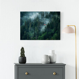 Obraz na płótnie Kolejka górska w chmurach nad zamglonym lasem