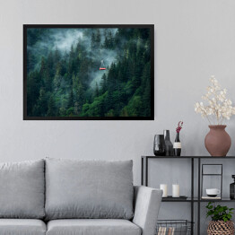 Obraz w ramie Kolejka górska w chmurach nad zamglonym lasem