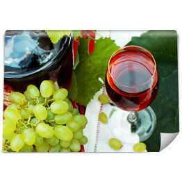 Fototapeta Kieliszek wina i winogrona na stole