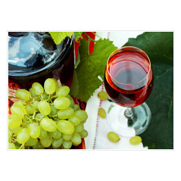 Plakat Kieliszek wina i winogrona na stole
