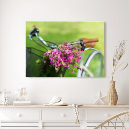 Obraz na płótnie Rower z różowymi kwiatami w koszu