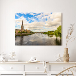 Obraz na płótnie Piękna katedra nad rzeką płynącą przez miasto
