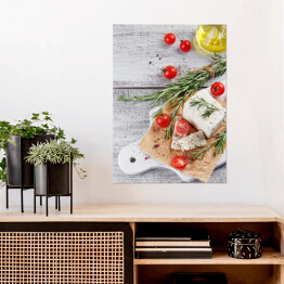 Plakat samoprzylepny Świeży ser feta z rozmarynem na białej drewnianej desce