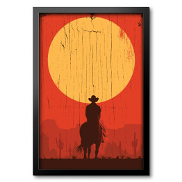 Obraz w ramie Cowboy jadący na koniu w stronę słońca