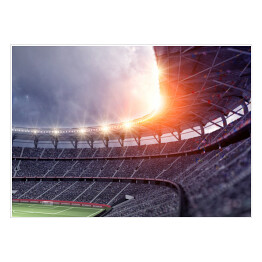 Słońce wschodzące zza stadionu do gry w piłkę nożną