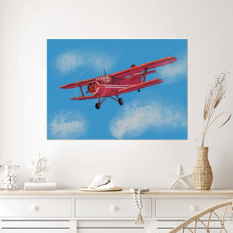Plakat Czerwony samolot lecący po błękitnym niebie