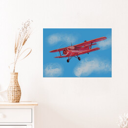 Czerwony samolot lecący po błękitnym niebie