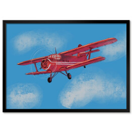 Plakat w ramie Czerwony samolot lecący po błękitnym niebie