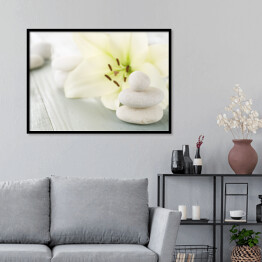 Plakat w ramie Zabiegi spa - kwiat i jasne kamienie do masażu