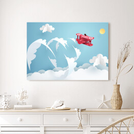 Obraz na płótnie Czerwony samolot wykonujący akrobacje na niebie